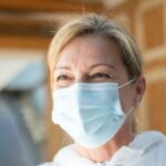 Masked healthcare professional supporting secure patient health data management 1